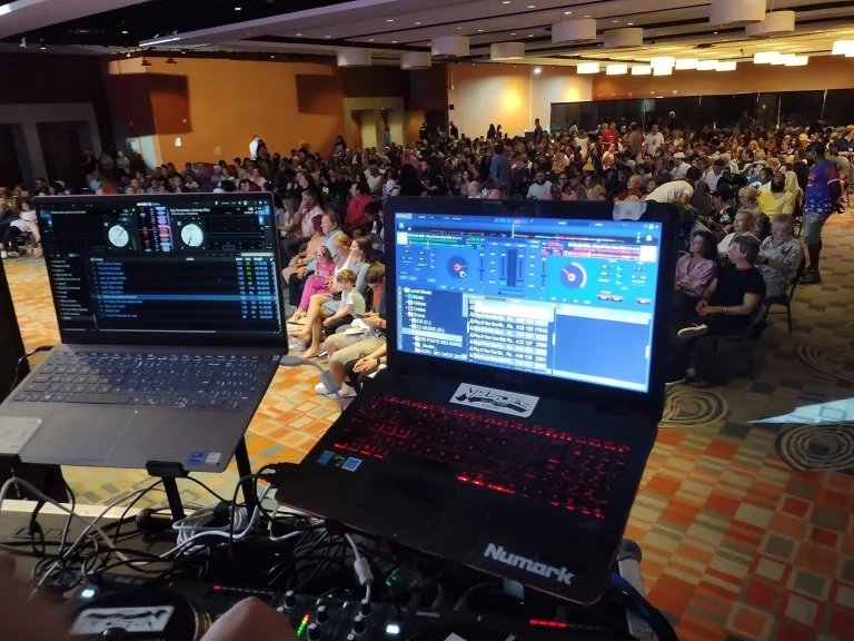 View from the DJ booth over a packed ballroom at the ProAm Dance and DJ Expo