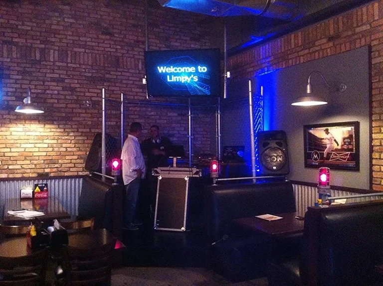 DJ booth with blue uplighting ready for a private event