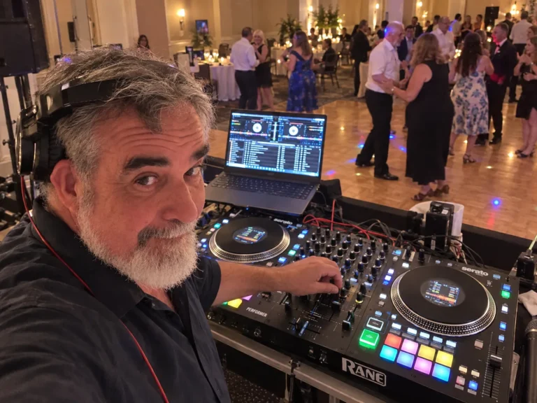 DJ 2RO at a Rane Performer while guests dance in a hotel ballroom