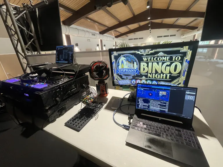 DJ and video control table for Epiphany 75th Anniversary Bingo Night