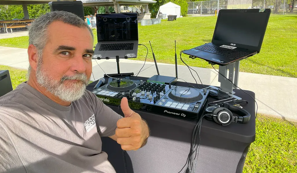 DJ 2RO (Arturo Morejon) behind his Pioneer DJ controller at an outdoor South Florida event